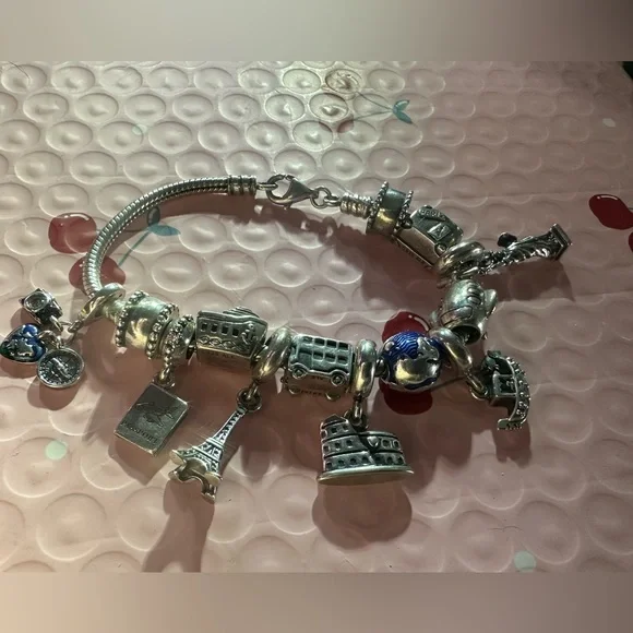 authentic Pandora Travelers charm bracelet. It’s a must have if u travel a-lot. - Picture 2 of 9
